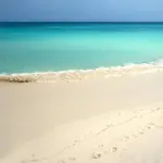 Book your dream honeymoon to Aruba with all-inclusive packages including airfare, luxury accommodations, and romantic experiences on the white sand beaches