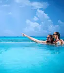 Experience adults-only opulence in the Maldives: where overwater bungalows meet azure lagoons, setting the scene for unrivaled romantic escapes.