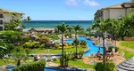 Waipouli Beach Resort Review: Discover family-friendly luxury in Kauai with 118 well-appointed condos featuring full kitchens. Enjoy thrilling water slides, a serene river pool
