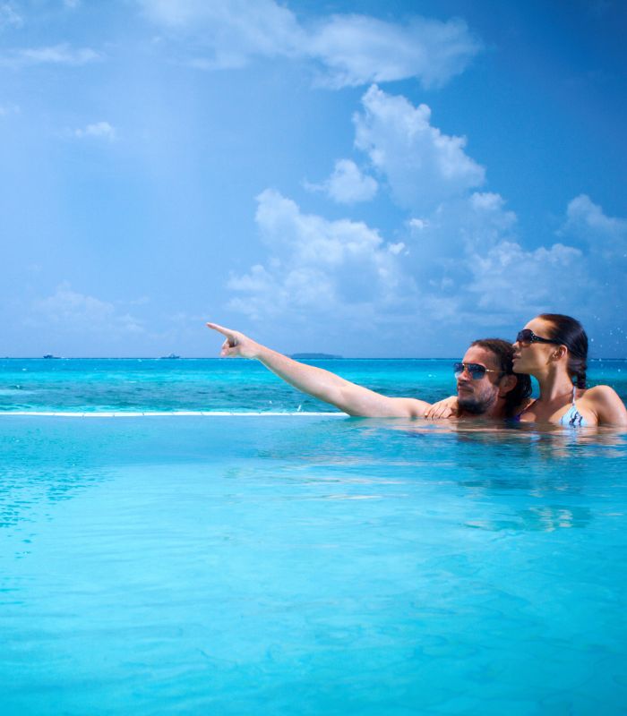 Experience adults-only opulence in the Maldives: where overwater bungalows meet azure lagoons, setting the scene for unrivaled romantic escapes.