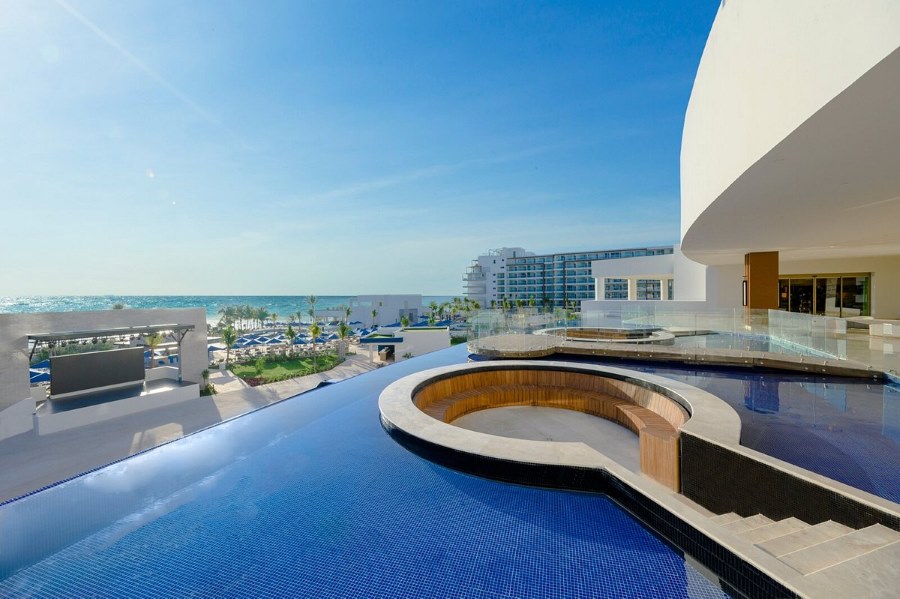 Dive into luxury at Royalton Splash Riviera Cancun: a family haven with a vast water park, diverse dining, and cultural explorations awaiting each day.